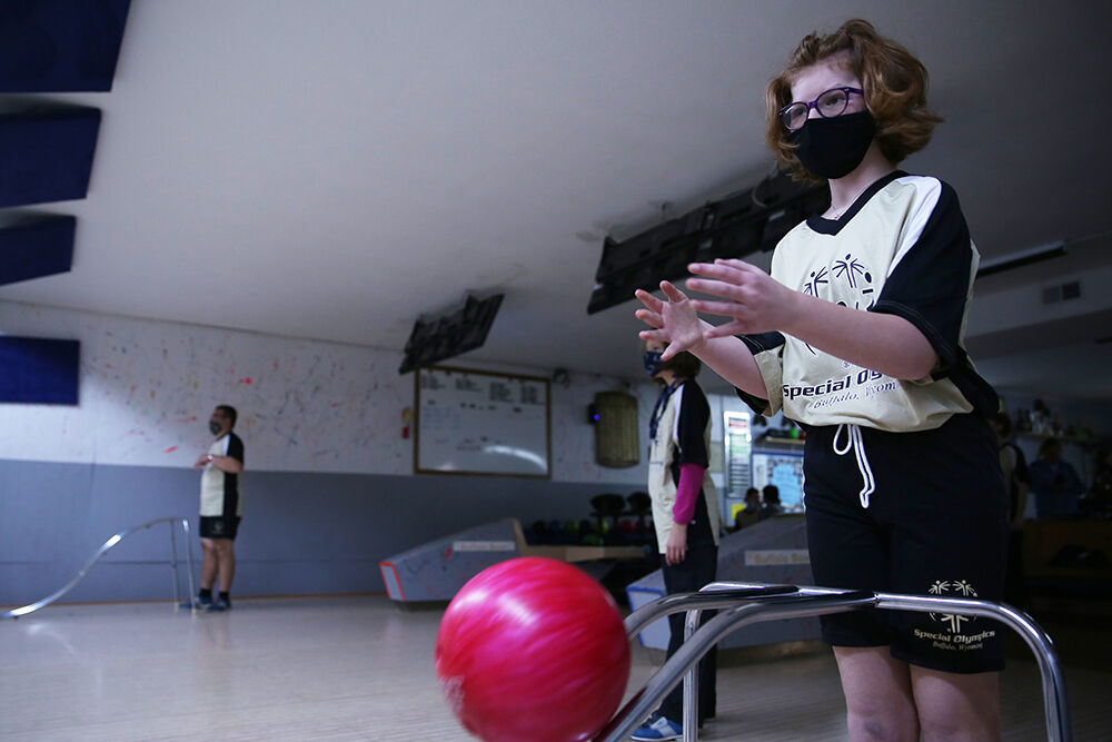 Ava Wright releases her ball down the bowling ramp